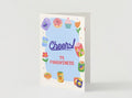 Front of Cheers to Forgiveness apology card featuring colorful party icons and confetti on a light background
