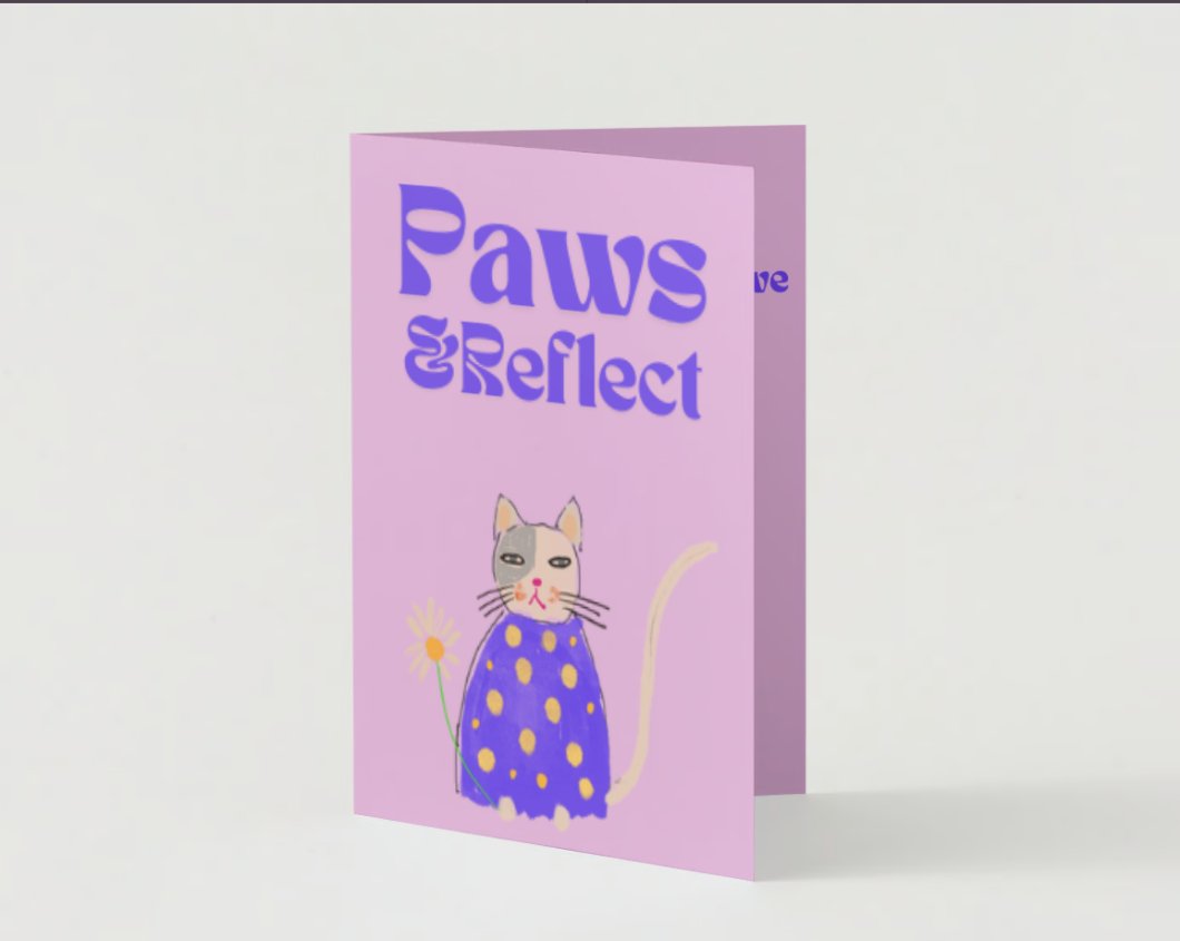 Front of Paws & Reflect apology card showing a serene cat on a purple background
